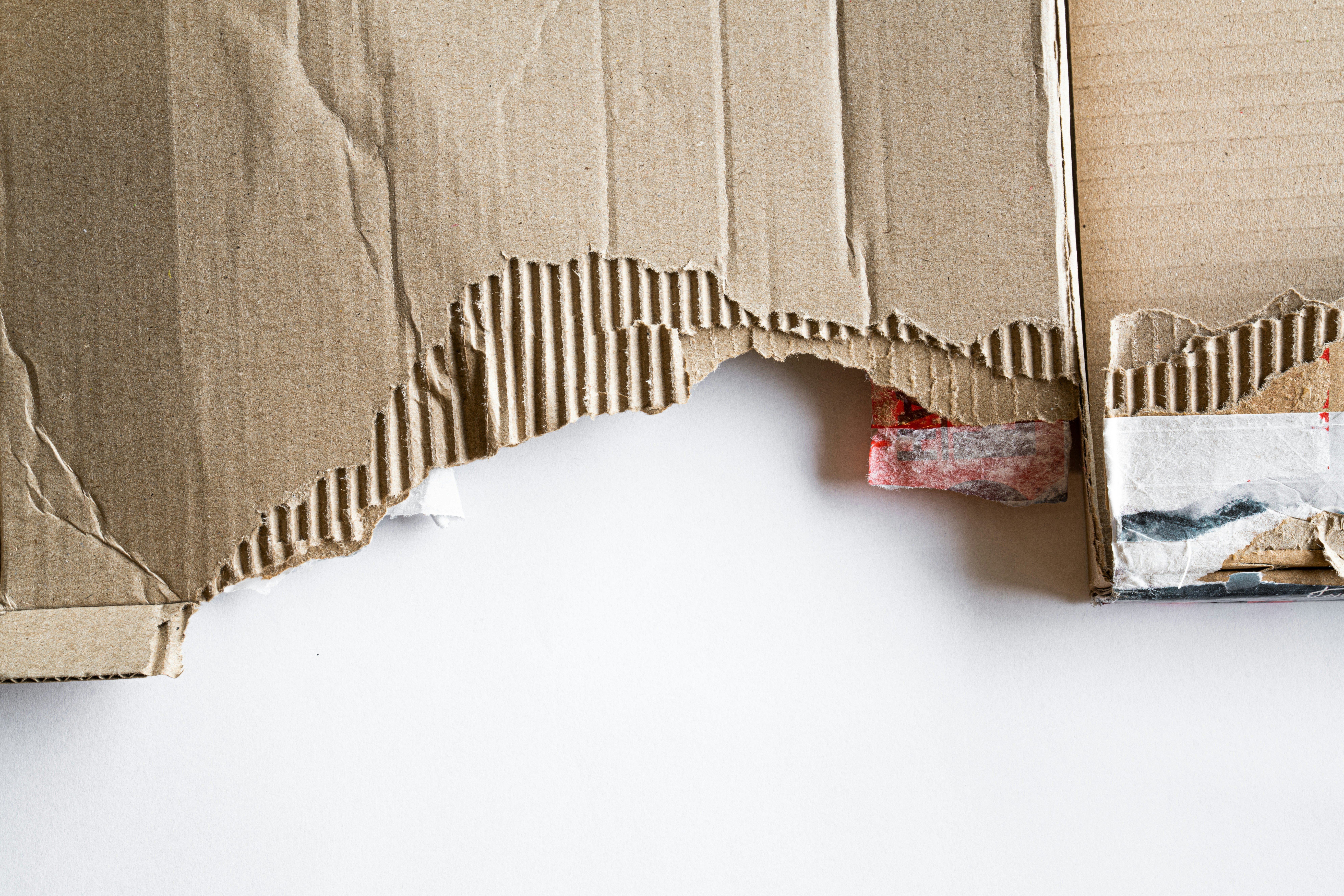 A cardboard box with a ripped edge