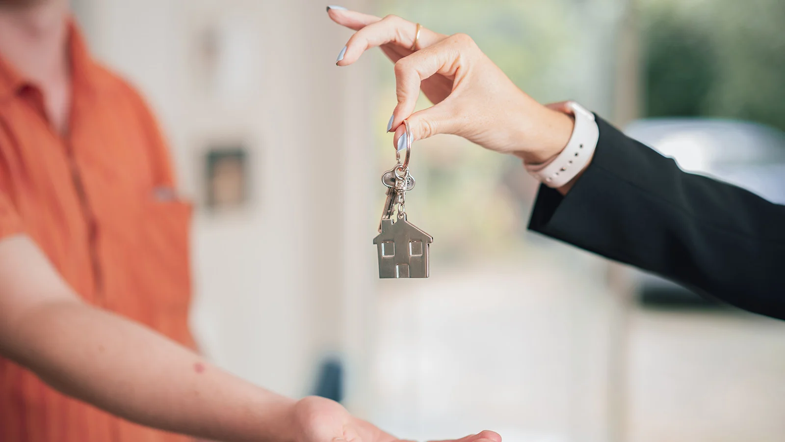 Landlord handing key to tenant. 