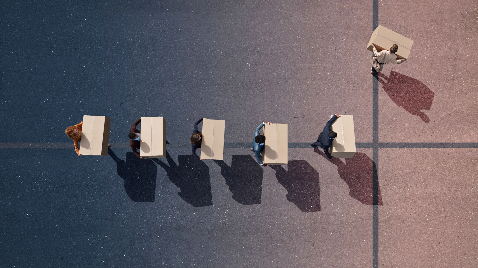 Employees leaving work with boxes.