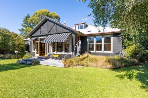 A character-filled former hospital in Little River, blending rich history with warmth, space, and creative charm.