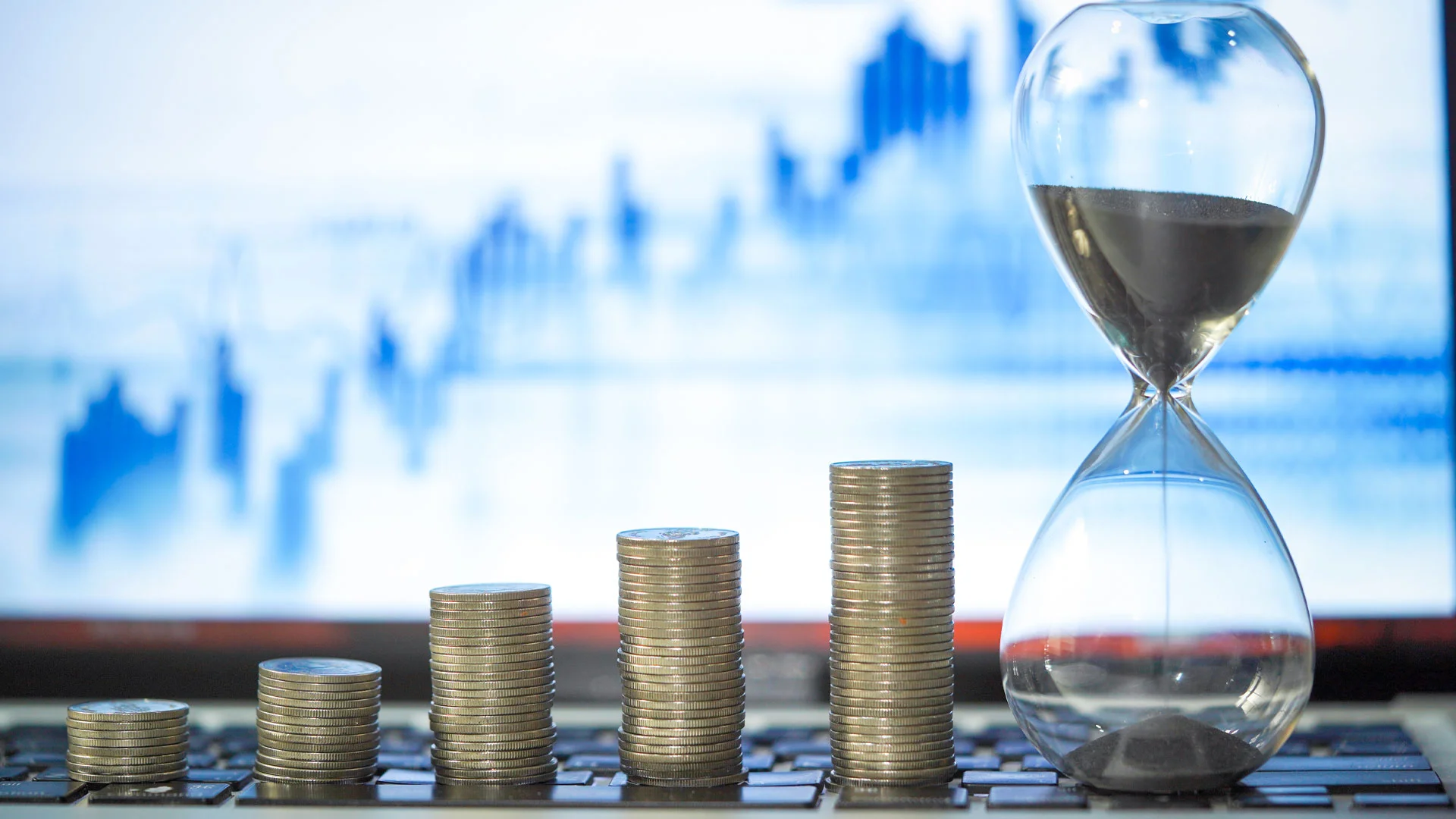 Graph showing changes in wage trends with coins in front of it.