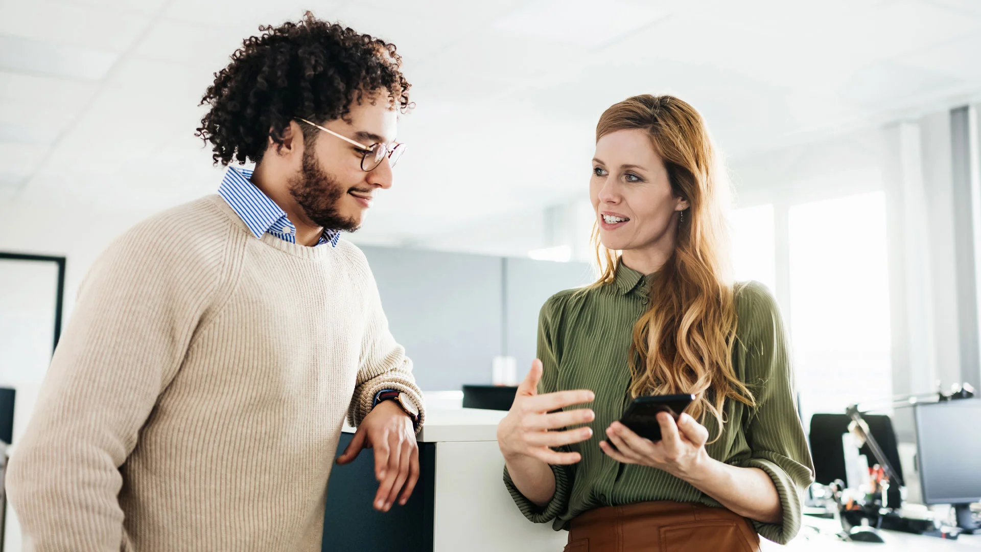 Employee helping their new boss find their way around the office.