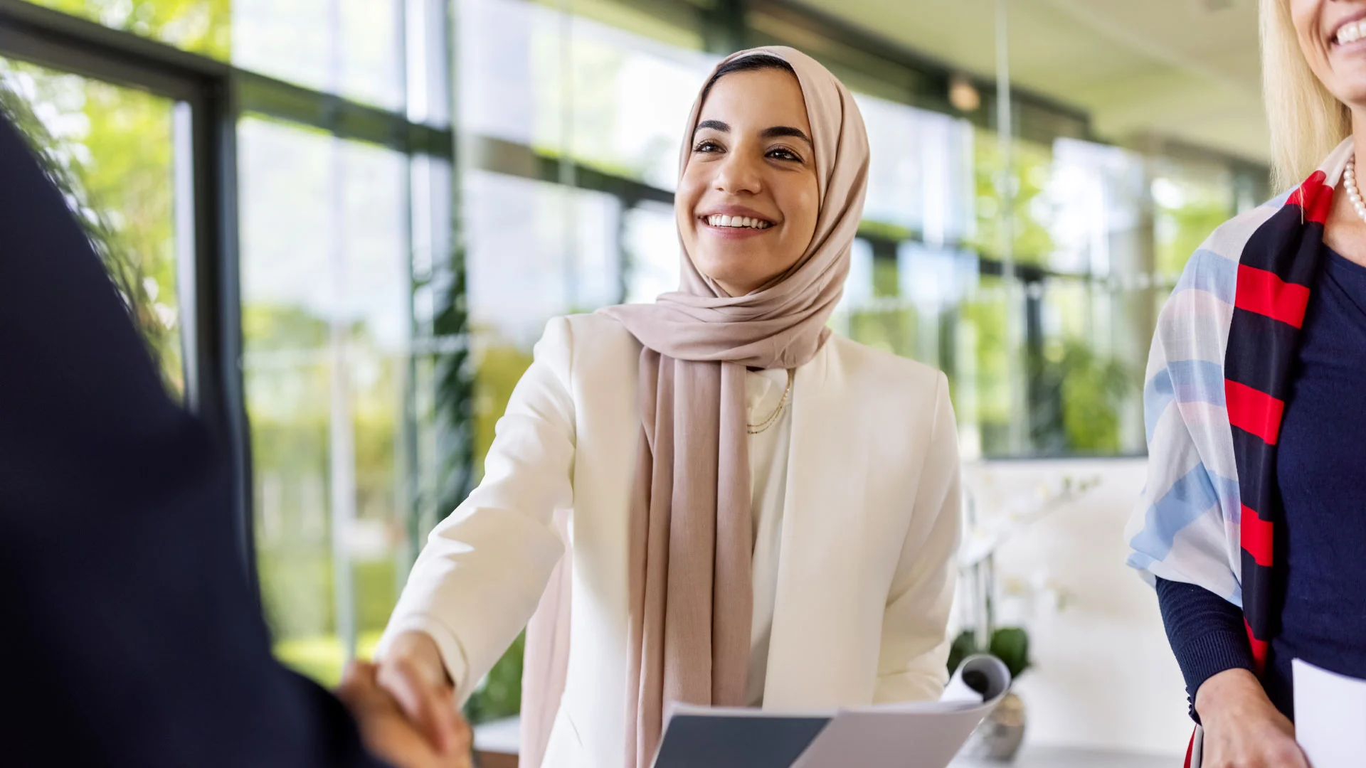 New employee shaking hands after securing a new job.