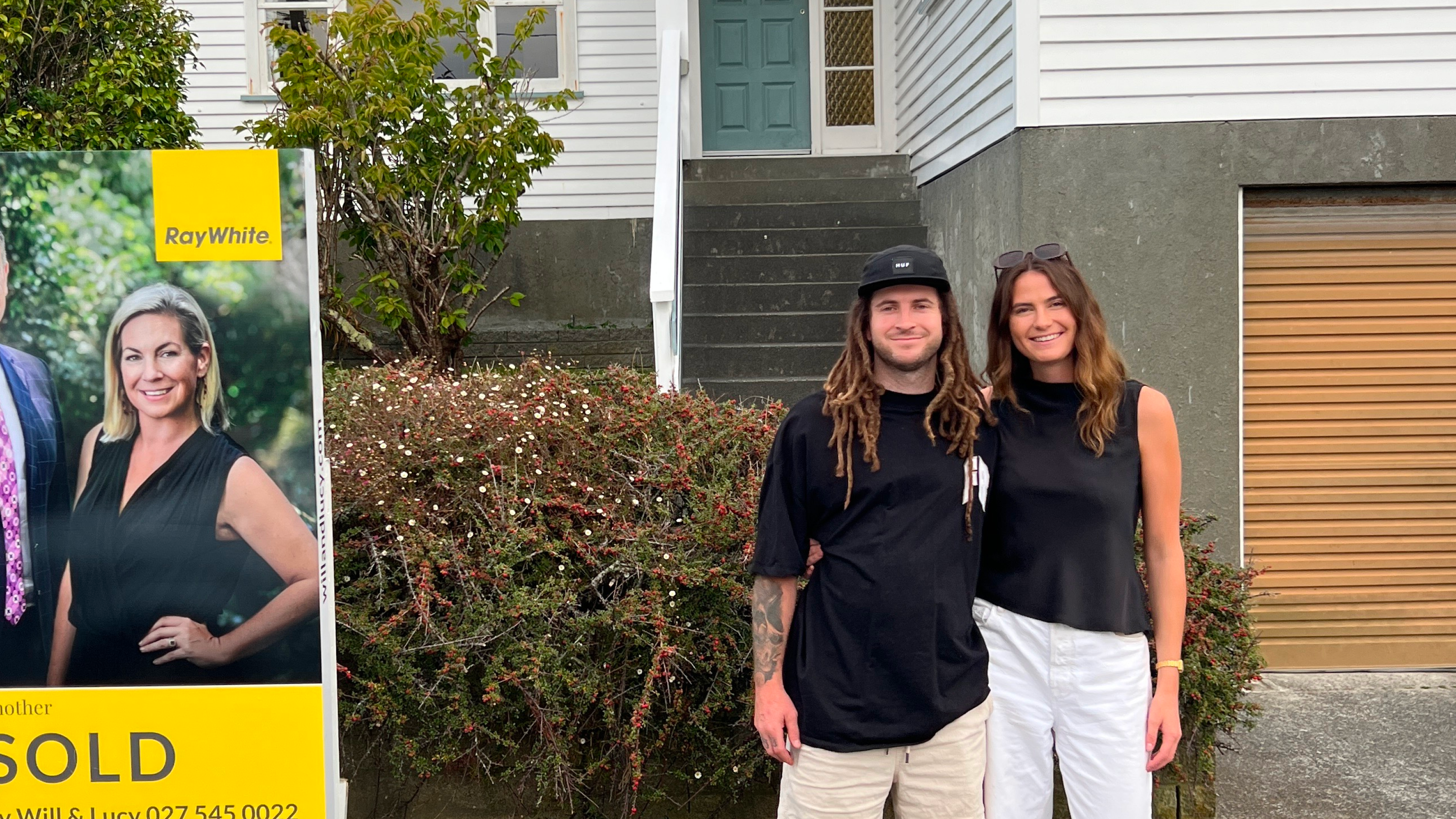 Rachel and Conor outside their first home