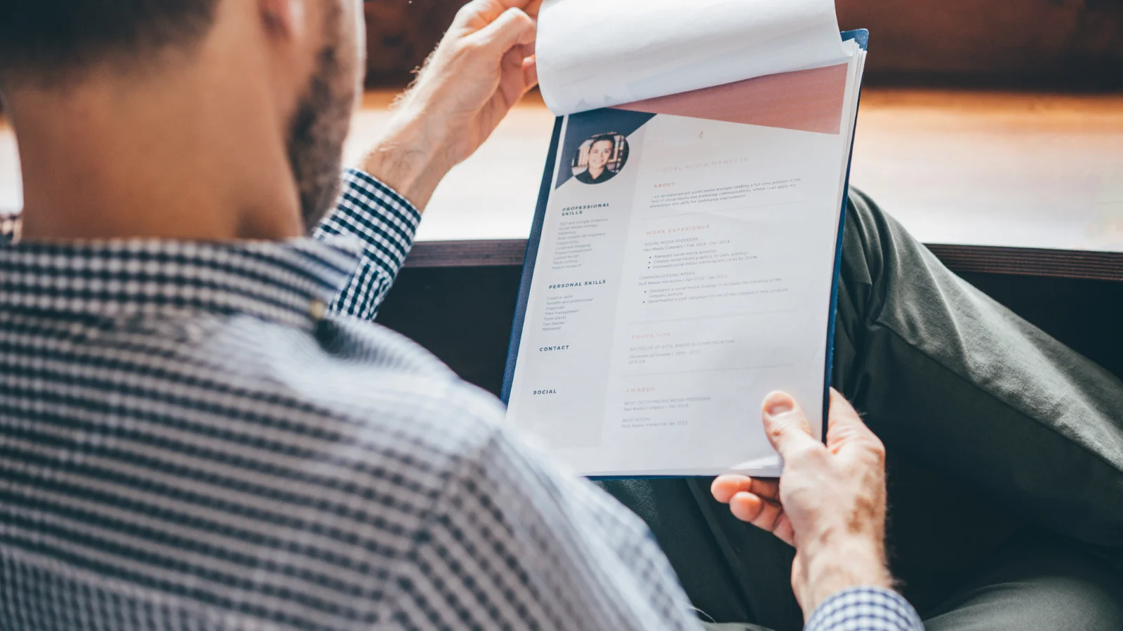 Guy looking at resume.