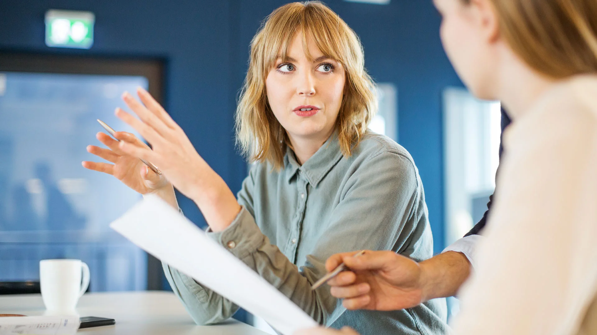 Two marketing professionals discussing the copy to accompany a product.
