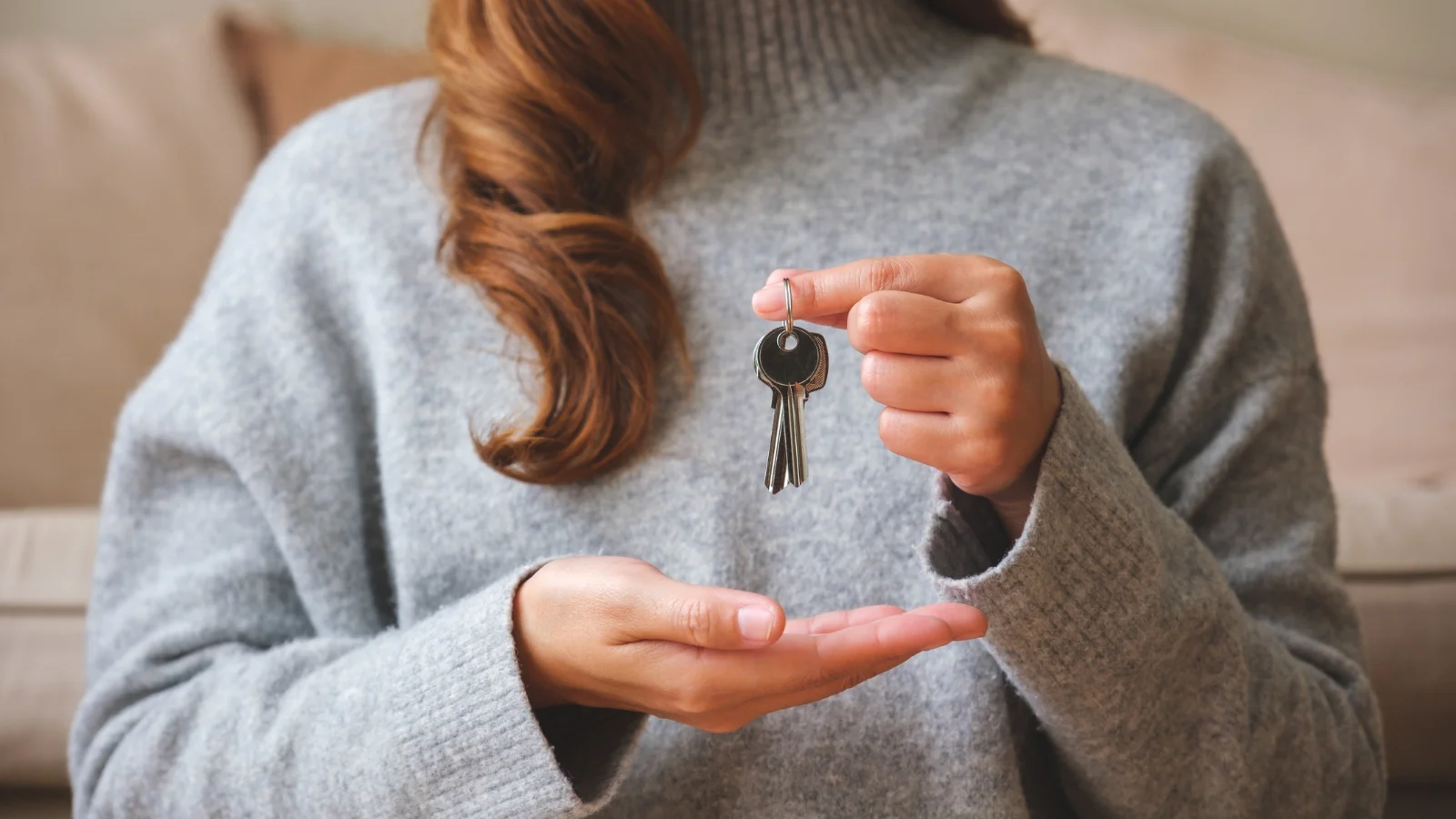 Lady holding keys.