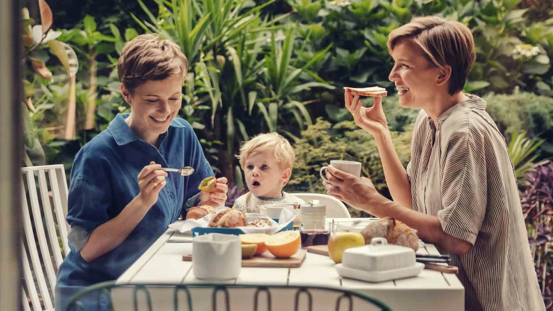 Family discussing relocation while eating.