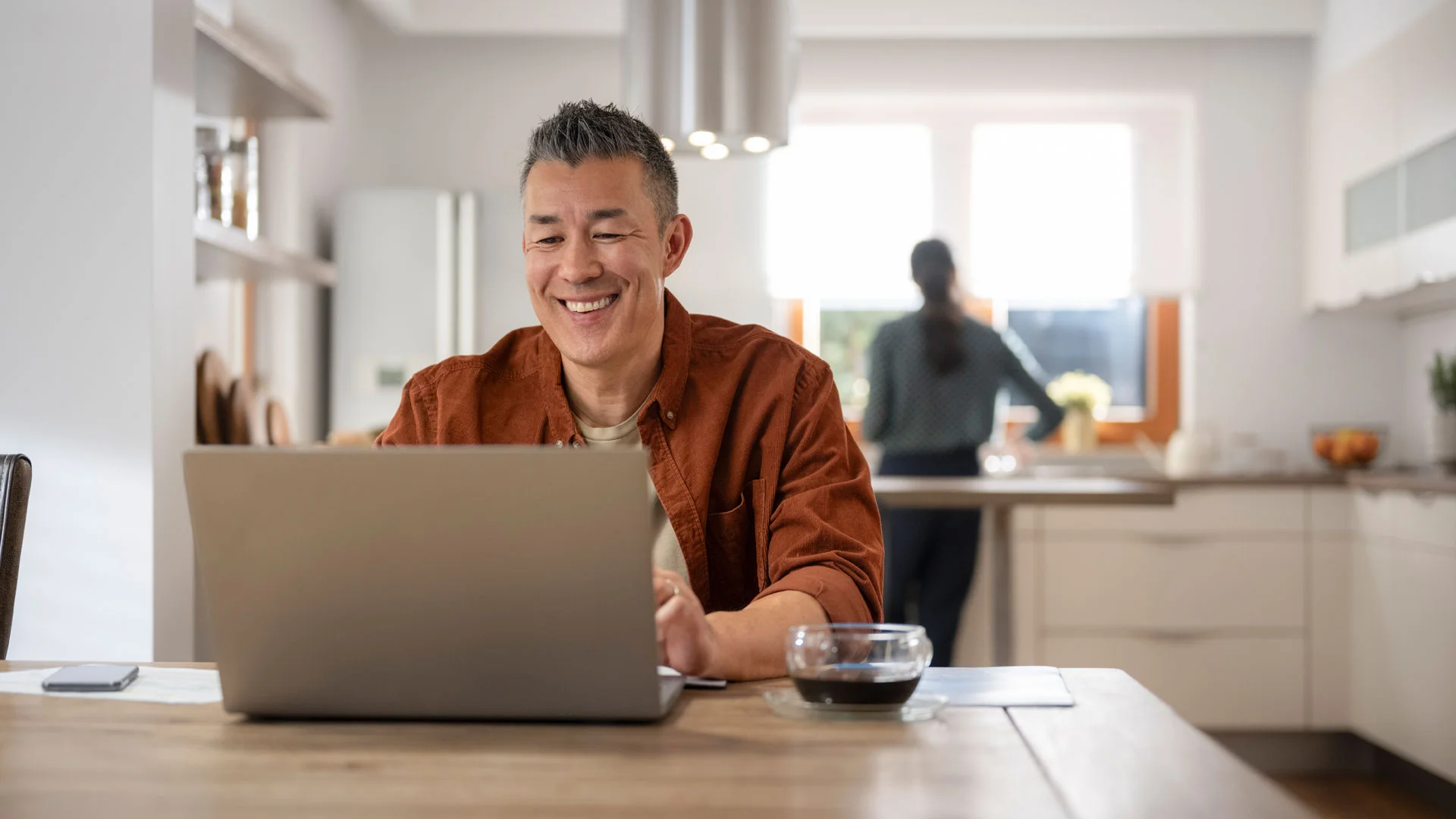 Landlord reading about their responsibilities on a laptop at home.