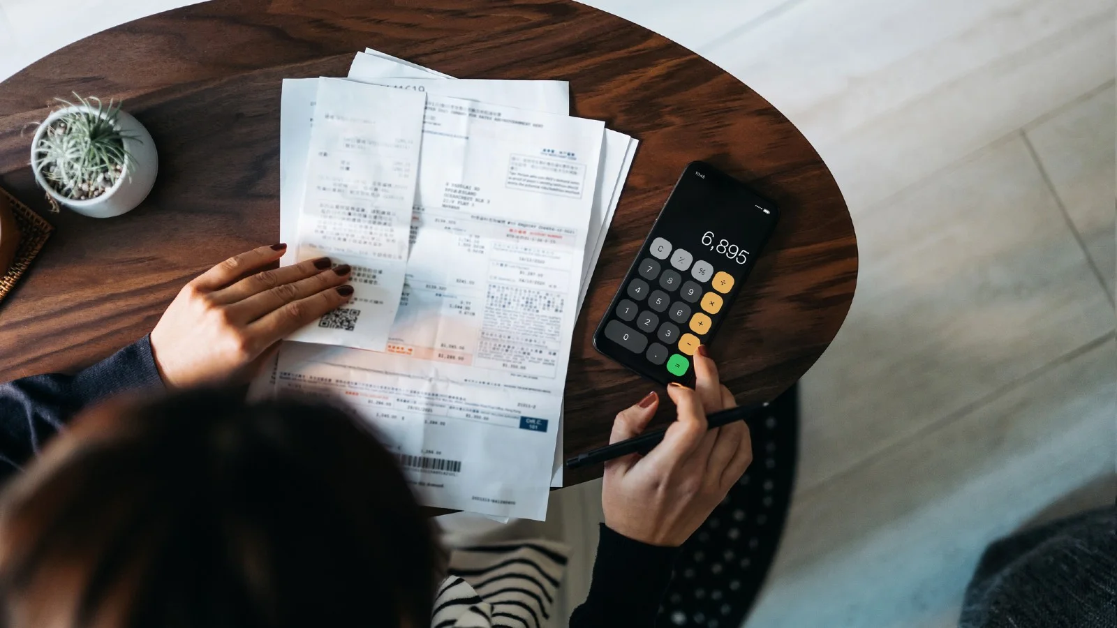 Lady working out what expenses can you claim on a rental property.