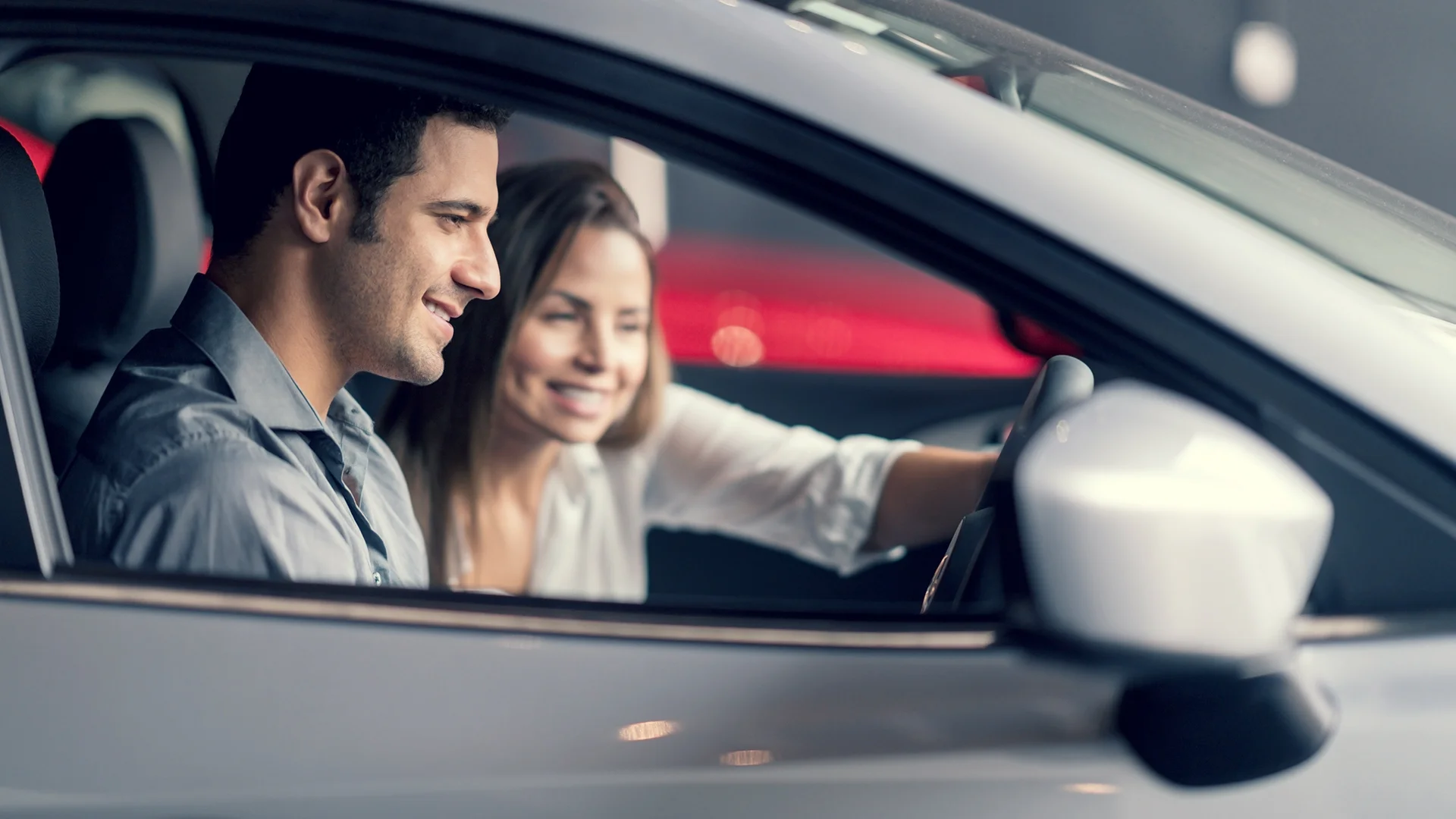 Two people about to travel in a car