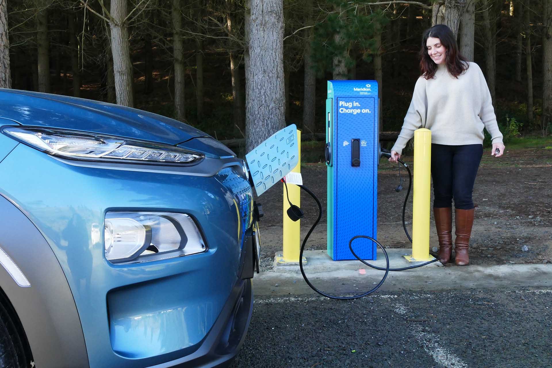 Blue EV at a charger station in Christchurch, NZ