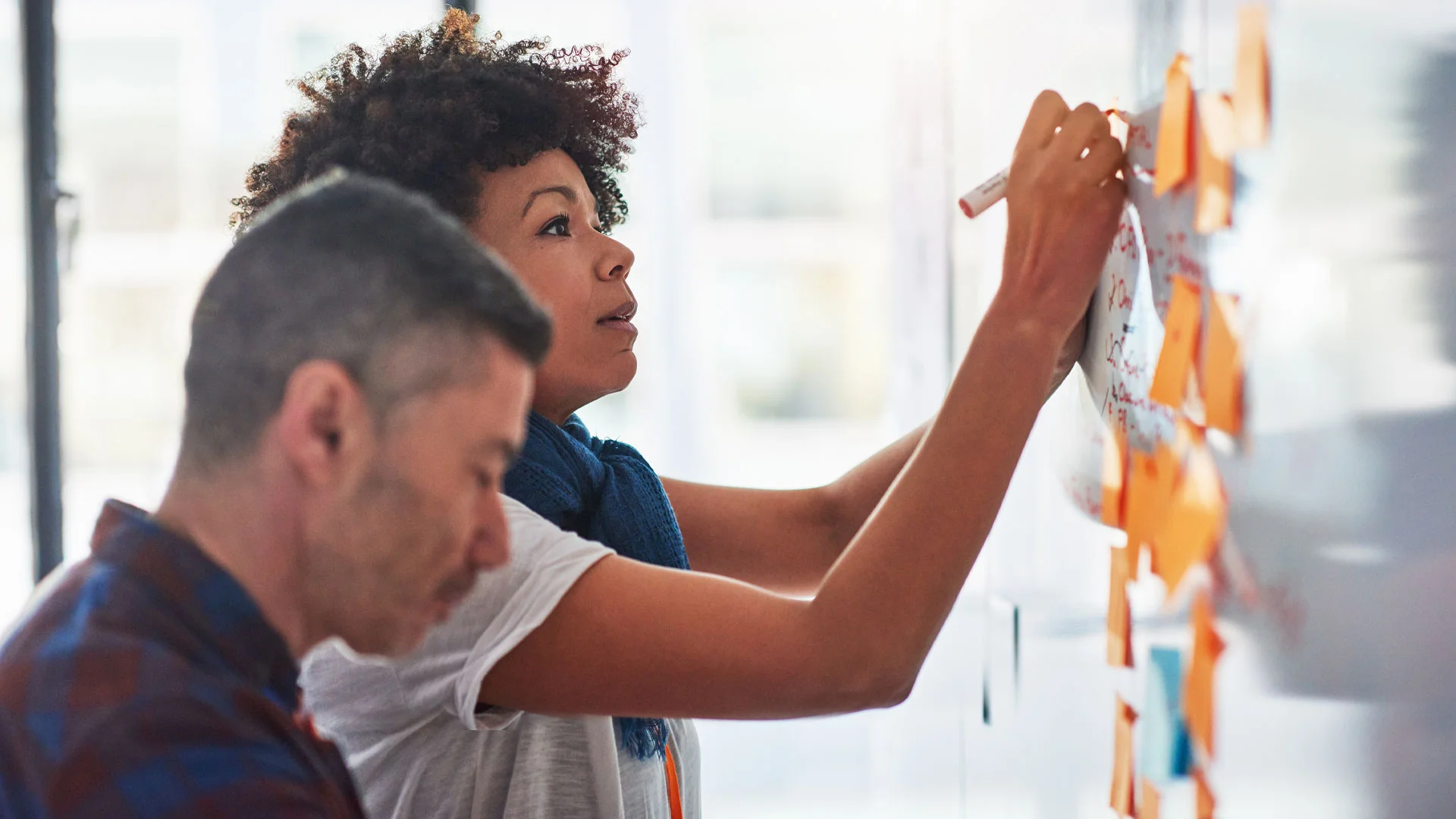Employees brainstorming a decision together.