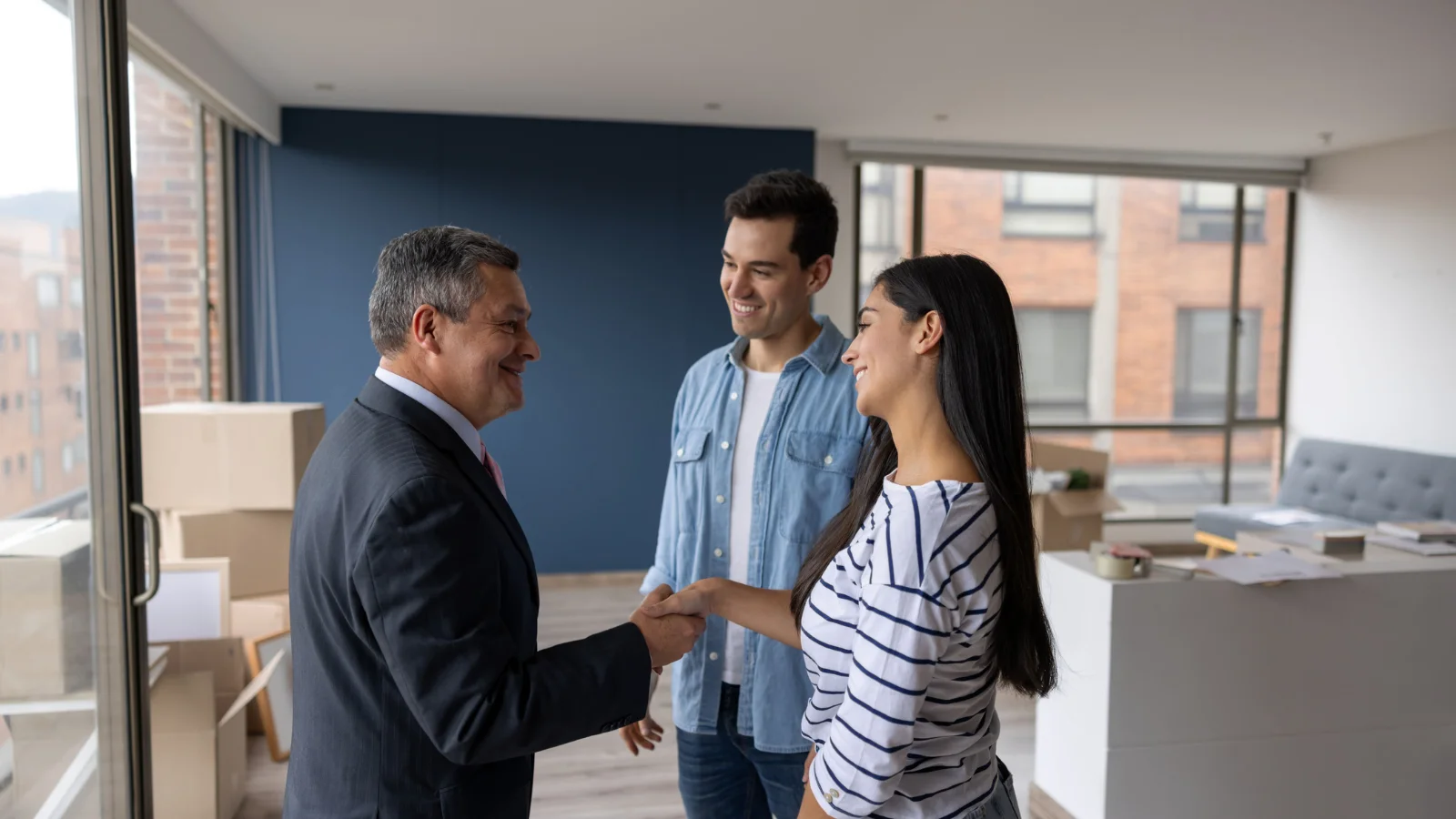 Landlord giving tenant keys.