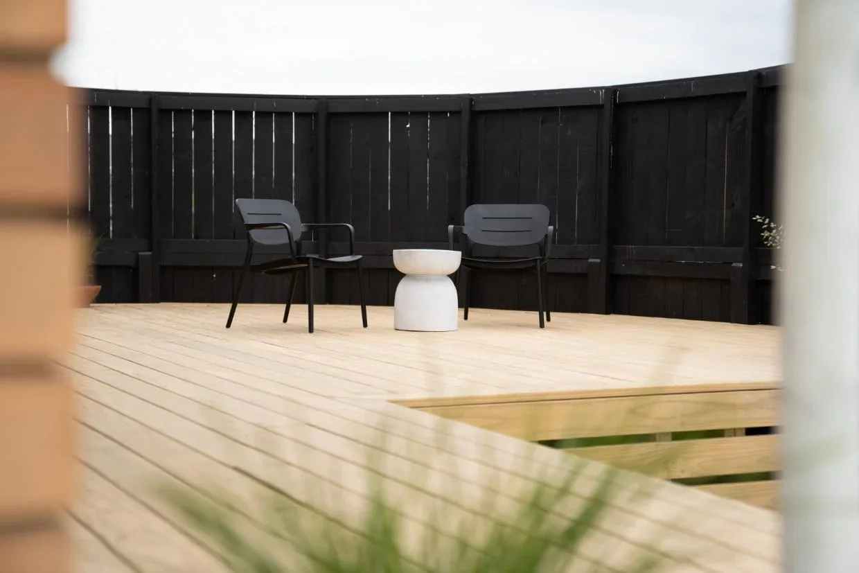 Photo of new deck with black fence