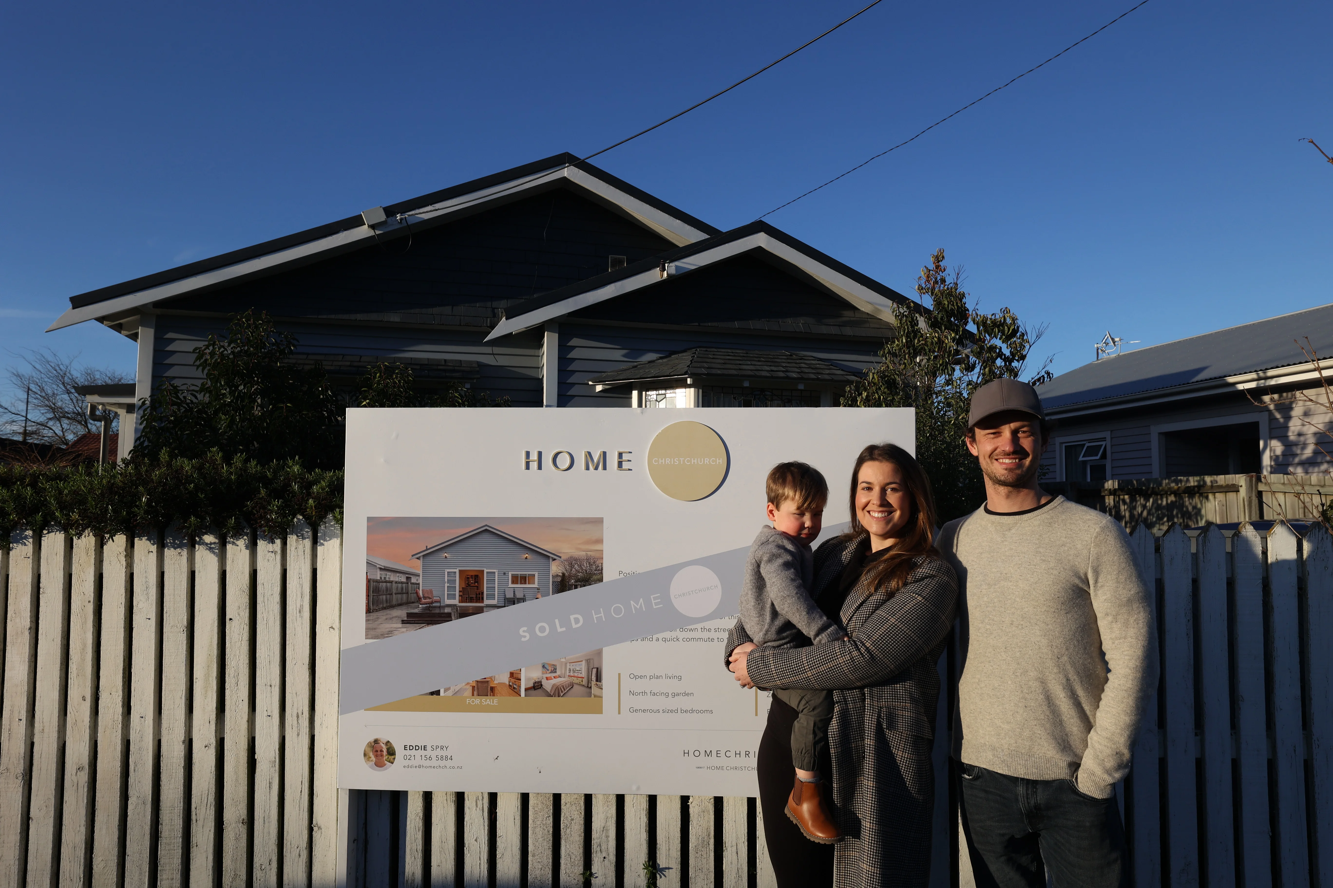 First home buyers Rebecca Stewart and Josh Fuller with their son outside their new home in Christchurch, purchased for $640,000.