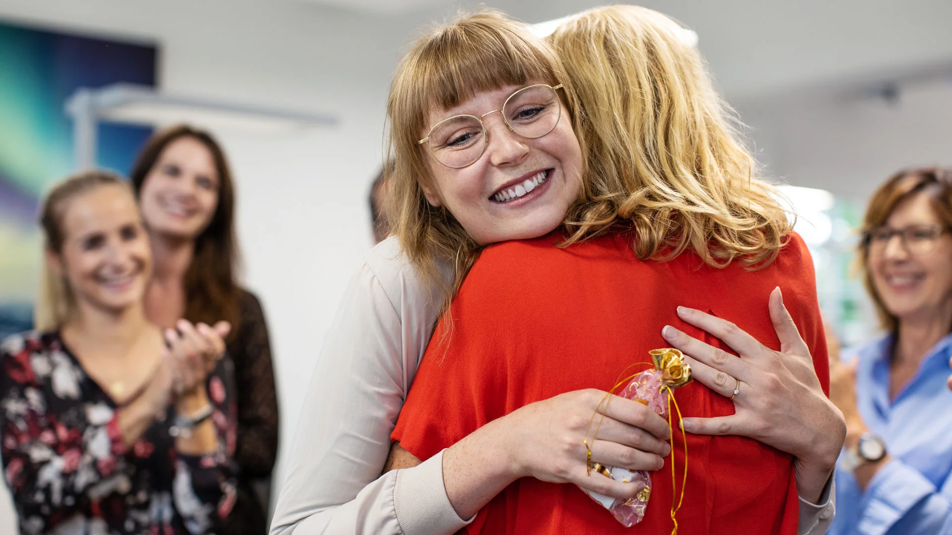 Employee celebrating a promotion at work.