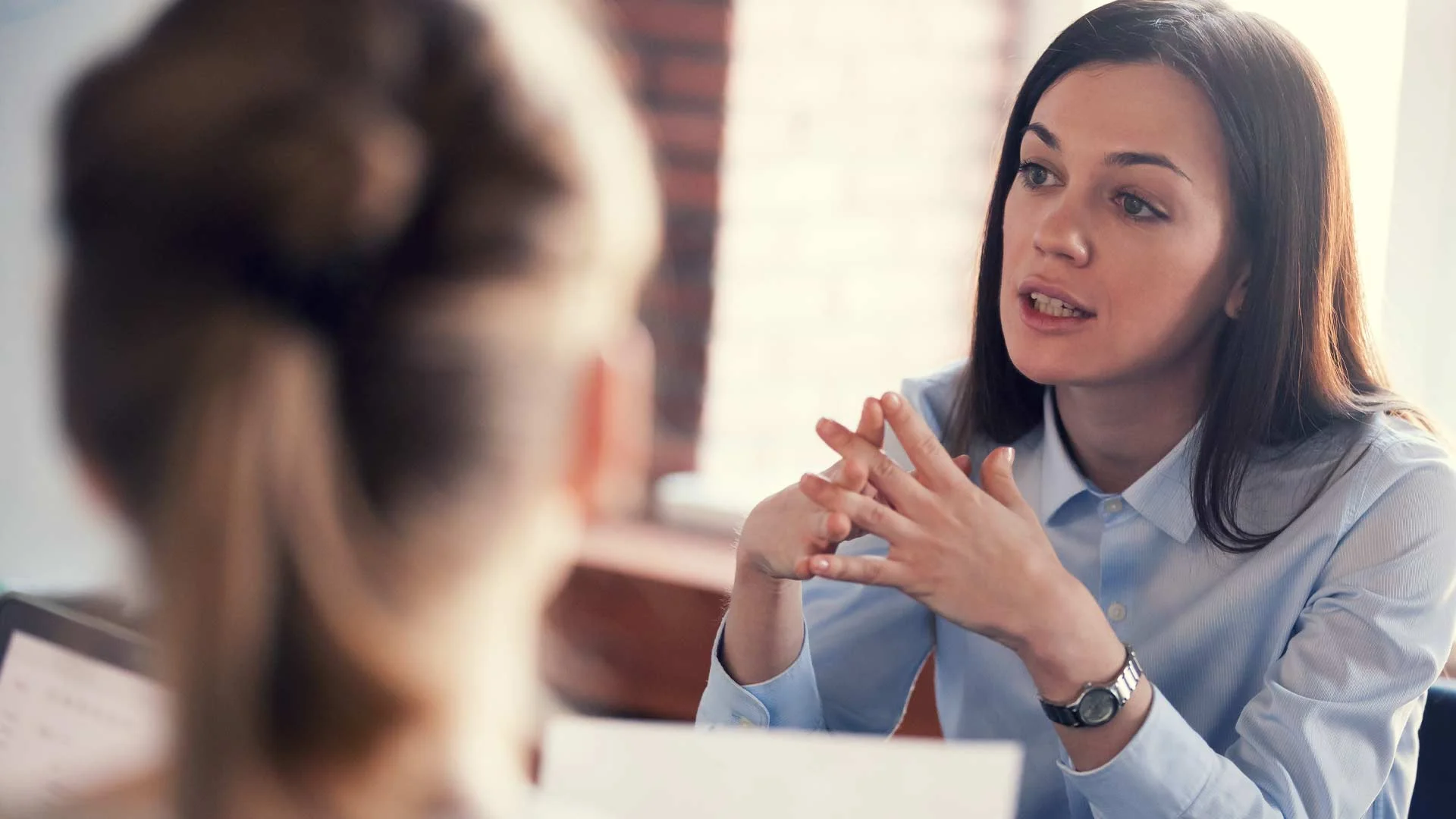 Female job hunter sitting in a job interview.