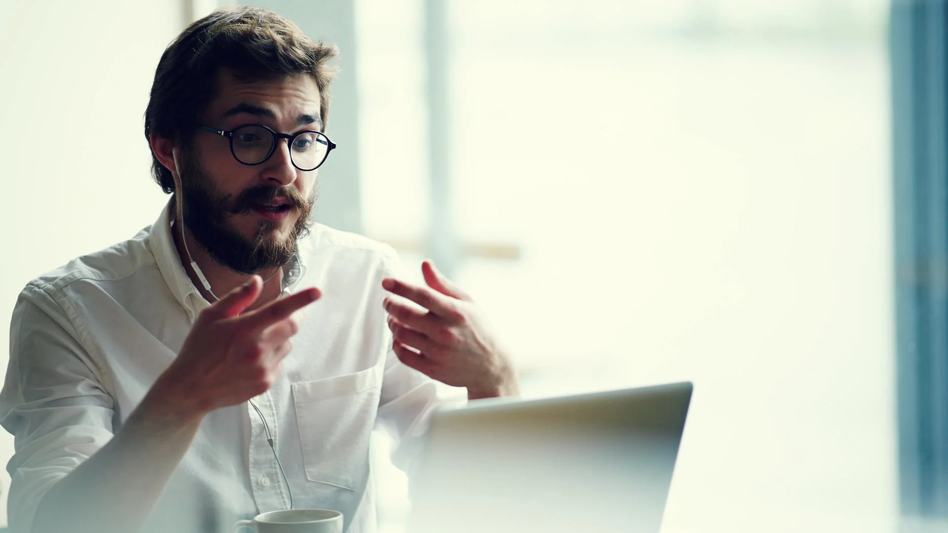 Young professional explaining why he is declining a job on the phone.