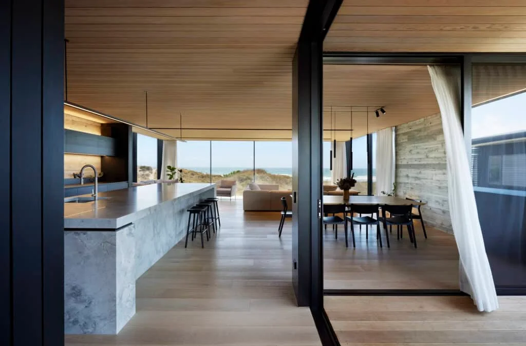 Achieving a coast vibe is about connection to the natural environment, enhanced through the use of floor-to-ceiling windows and sliding doors. Photo: Amanda Aitken