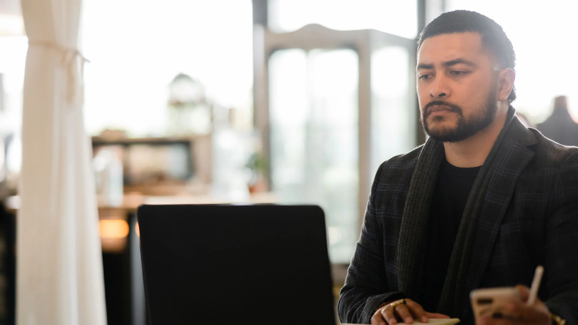 Finance analyst working on a laptop.