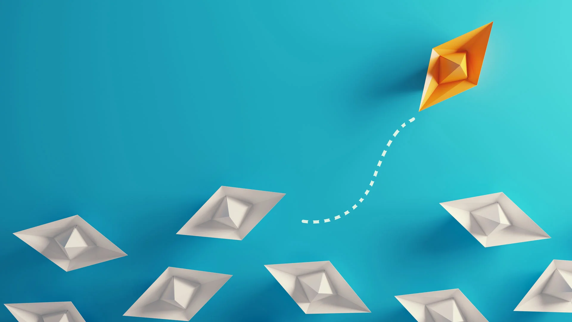 A group of paper boats, with one coloured yellow heading off in a different direction to the rest.