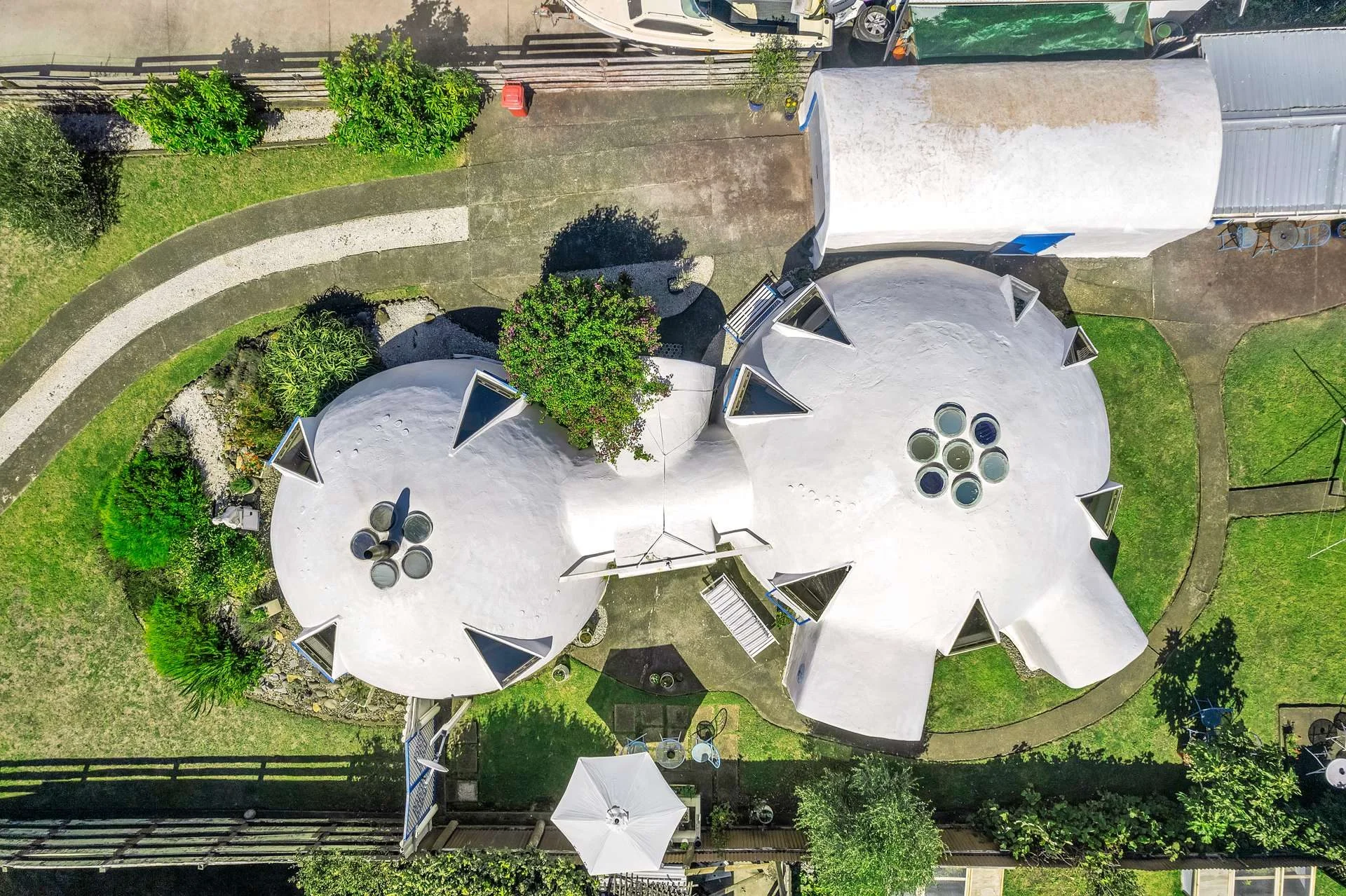 A birds eye view shot of a double domed house that wouldn't look out of place in Greece.