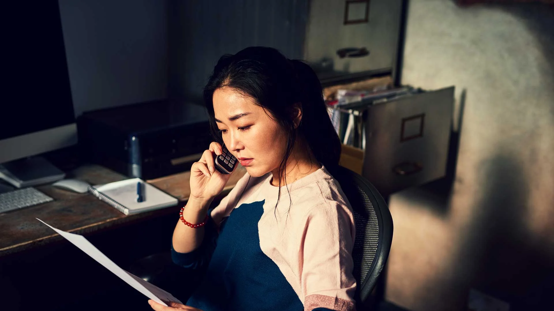 Candidate doing a phone interview in her home office.