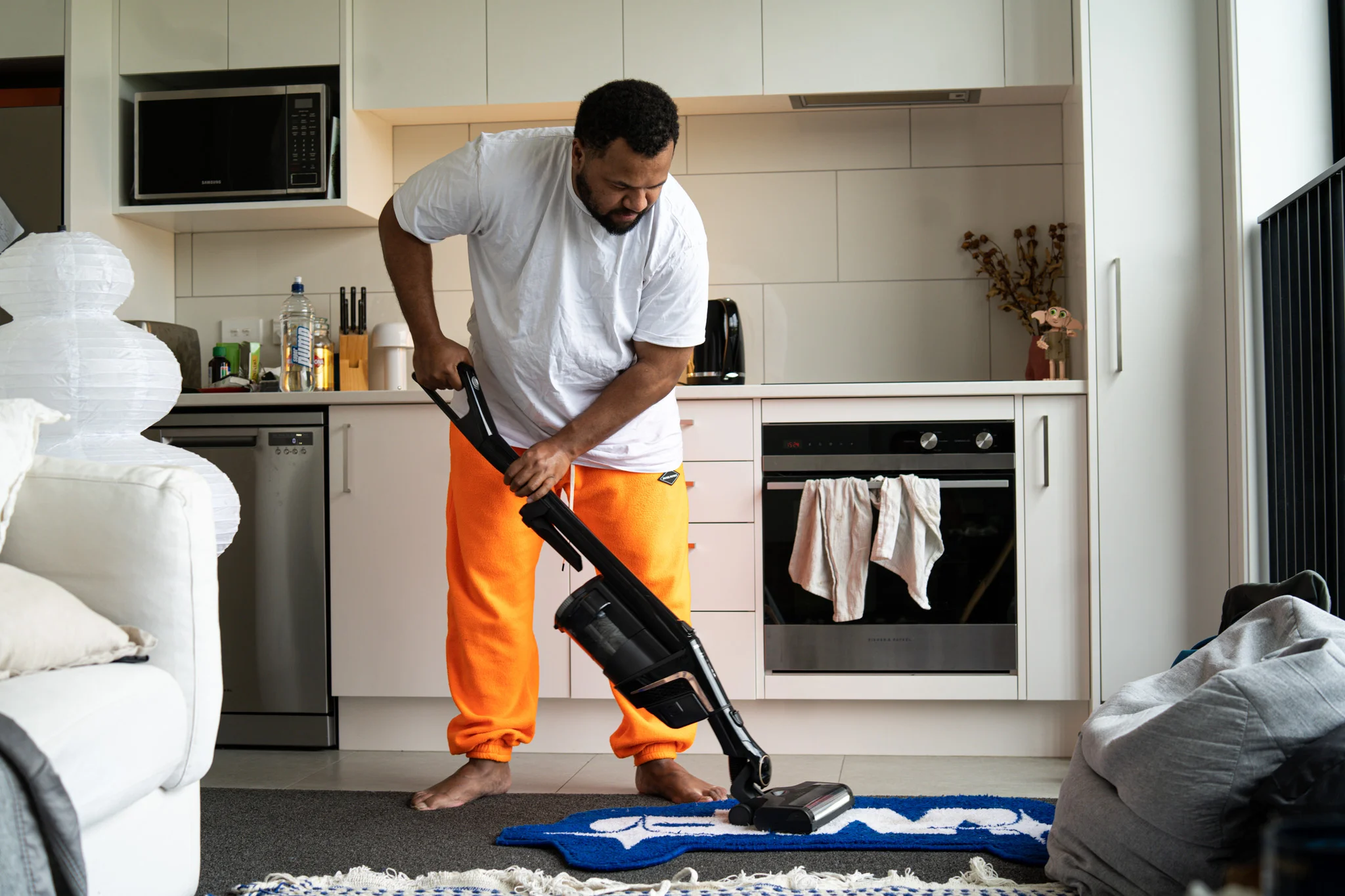Joey vacuuming his apartment in preparation of the interview