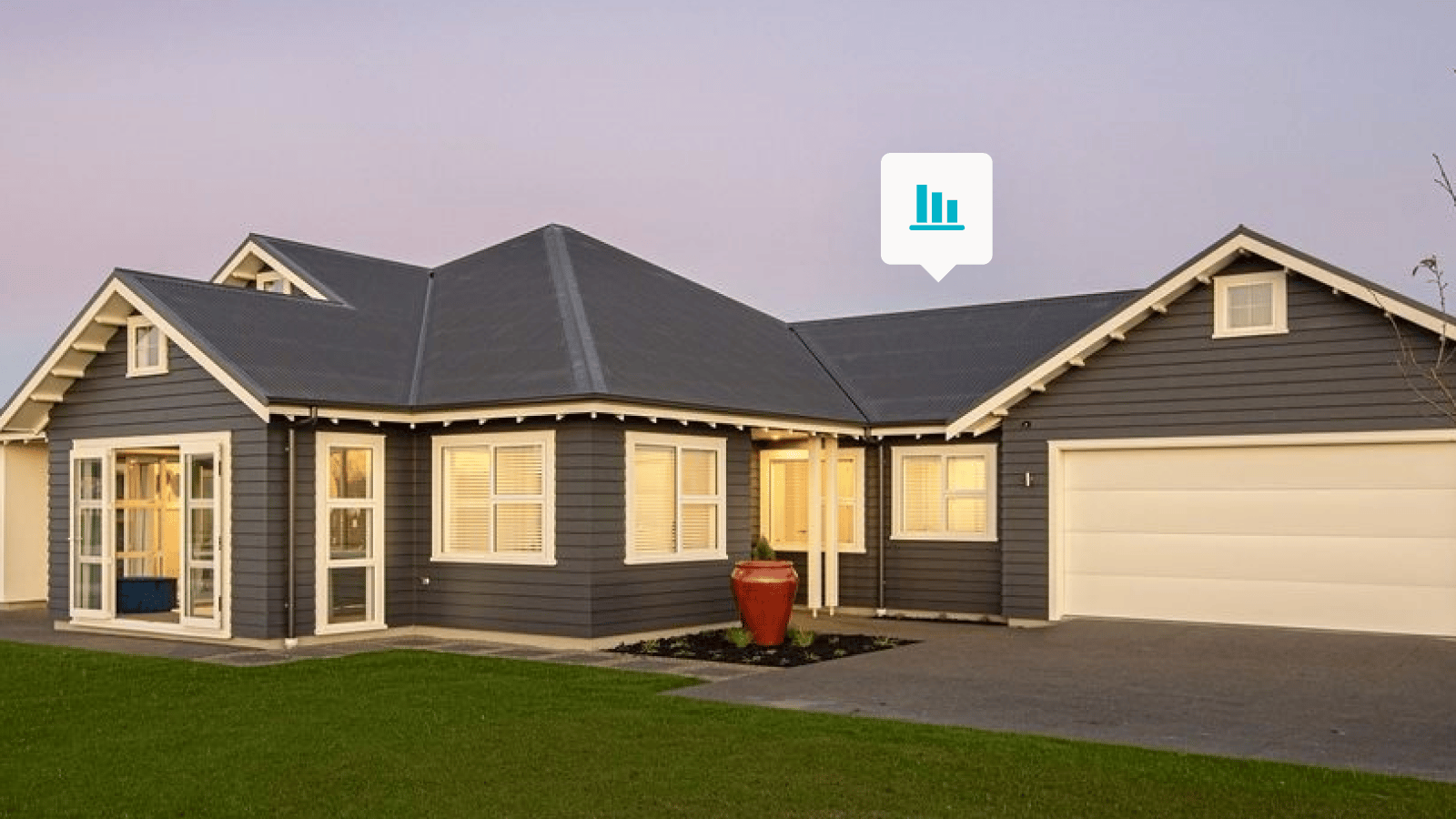 Slate grey home with a sunset