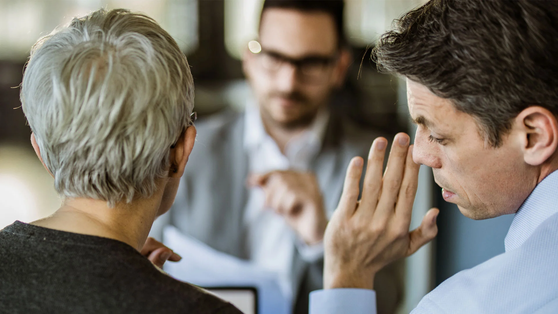 One job interviewer whispering to the other during an interview.
