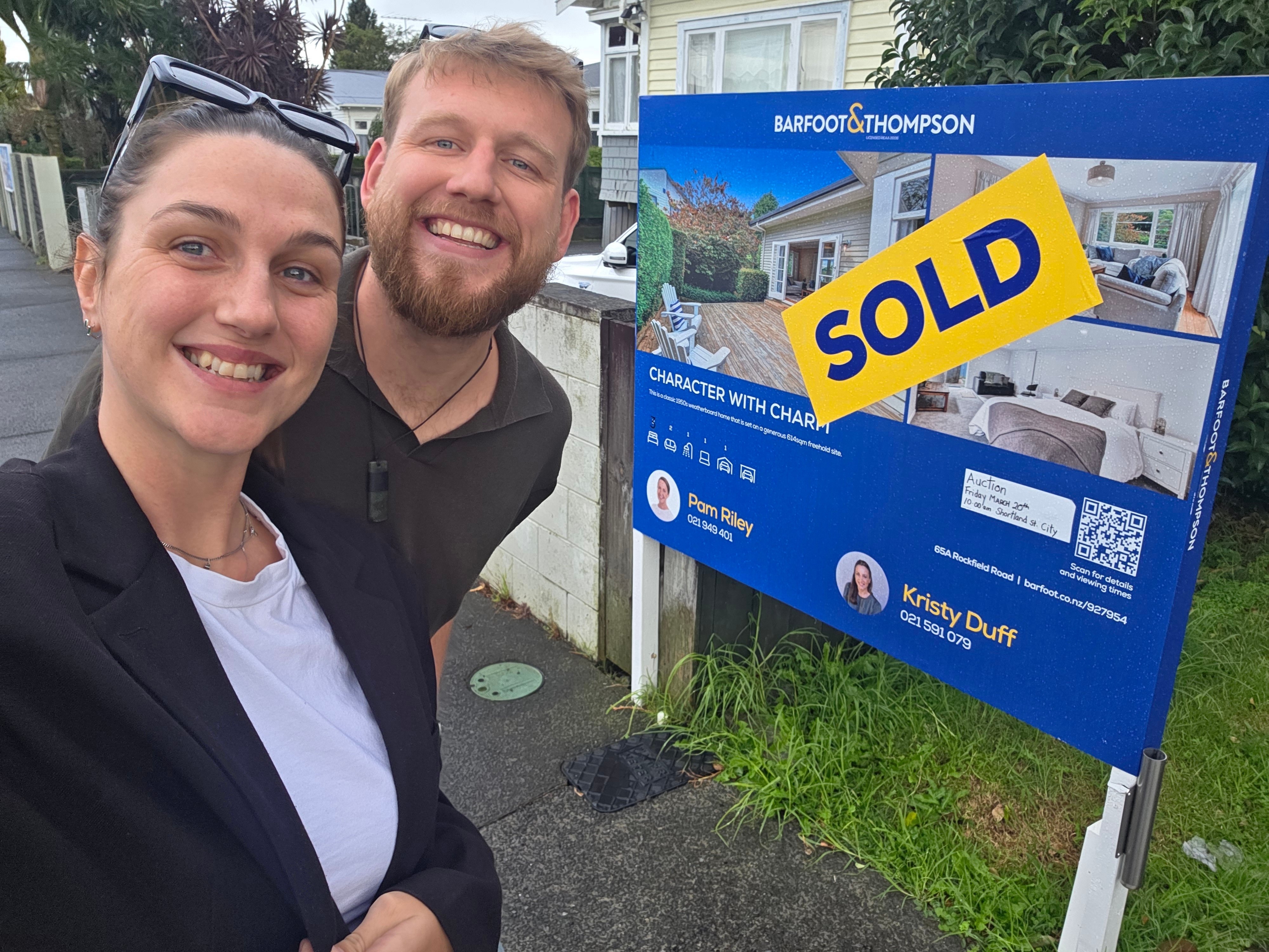 Zach and Zara outside their new home