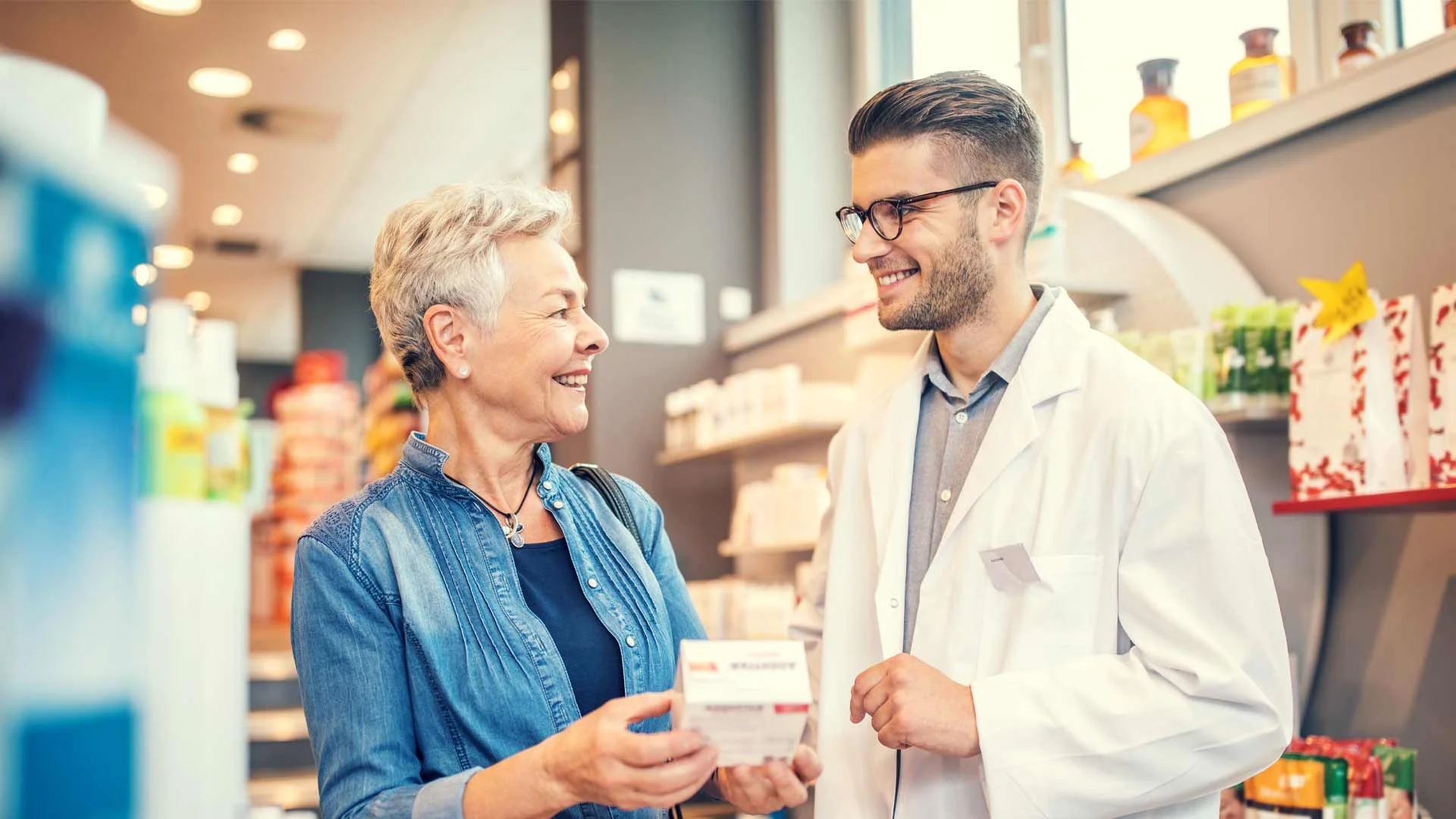 Pharmacist helping out a customer in New Zealand.