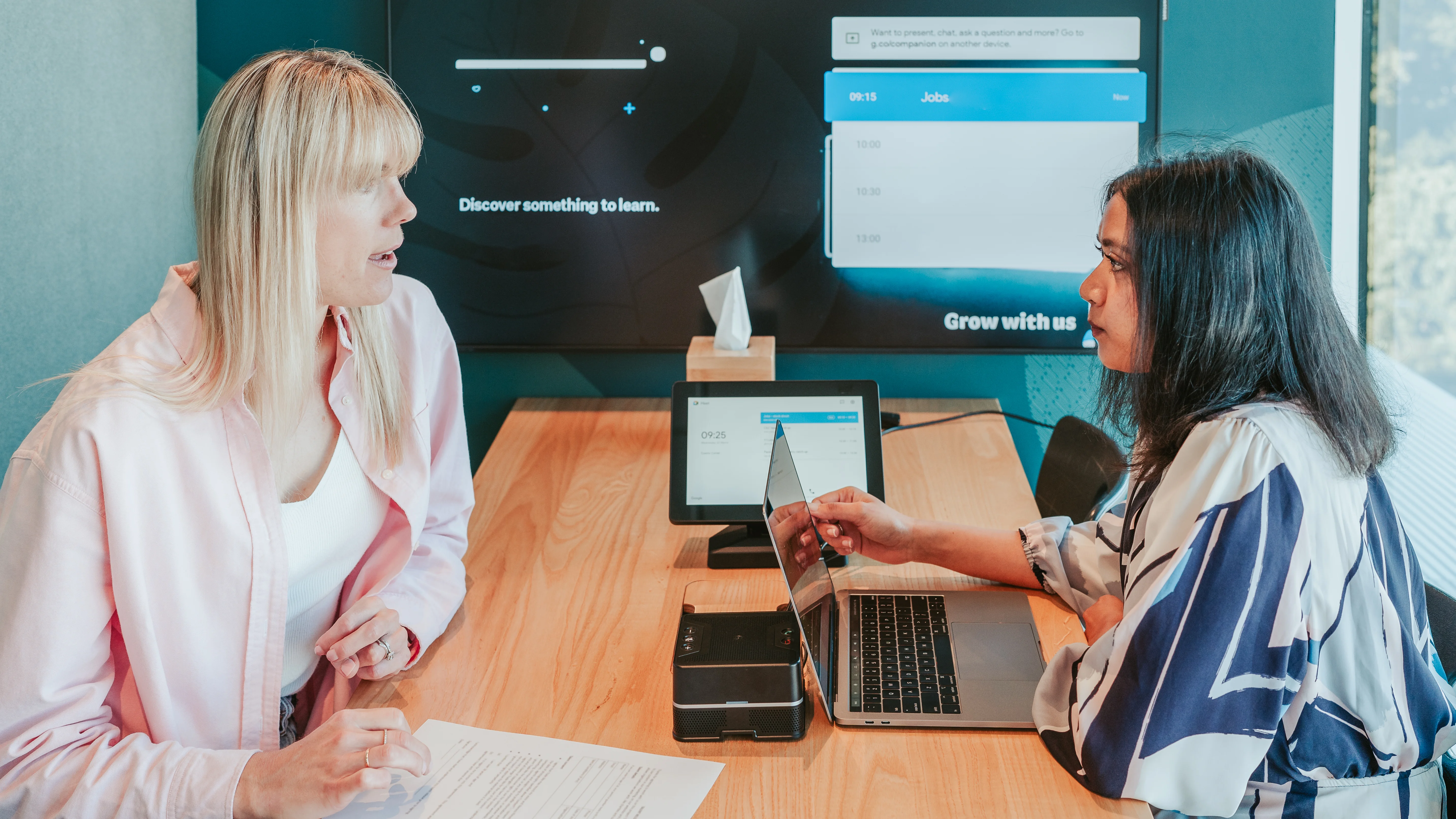 Two women in a meeting talking
