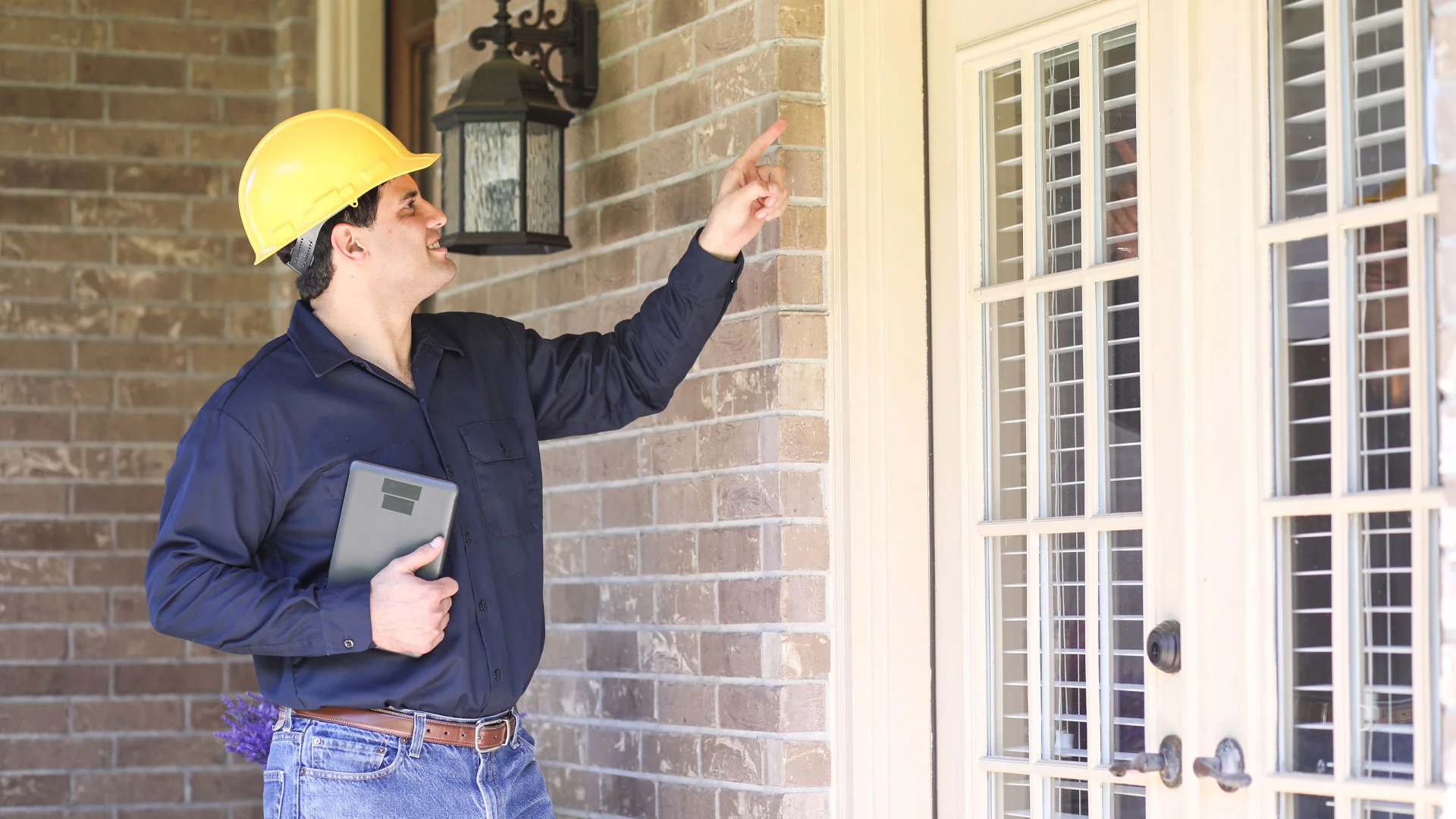 Builder inspecting a home in NZ.