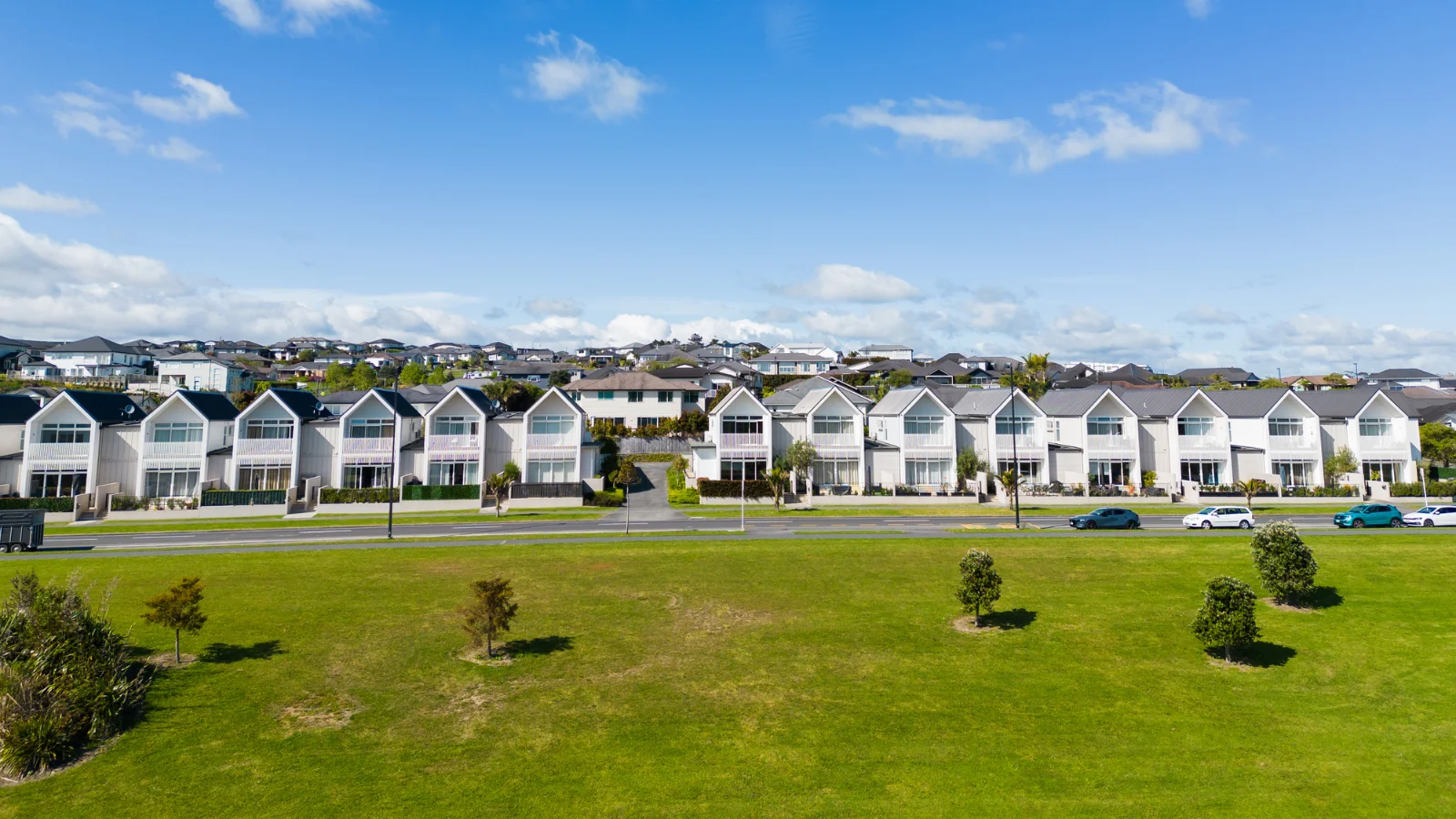 Townhouses on grass. 