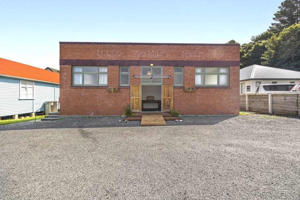 Front view of the former studio that is up for sale. 