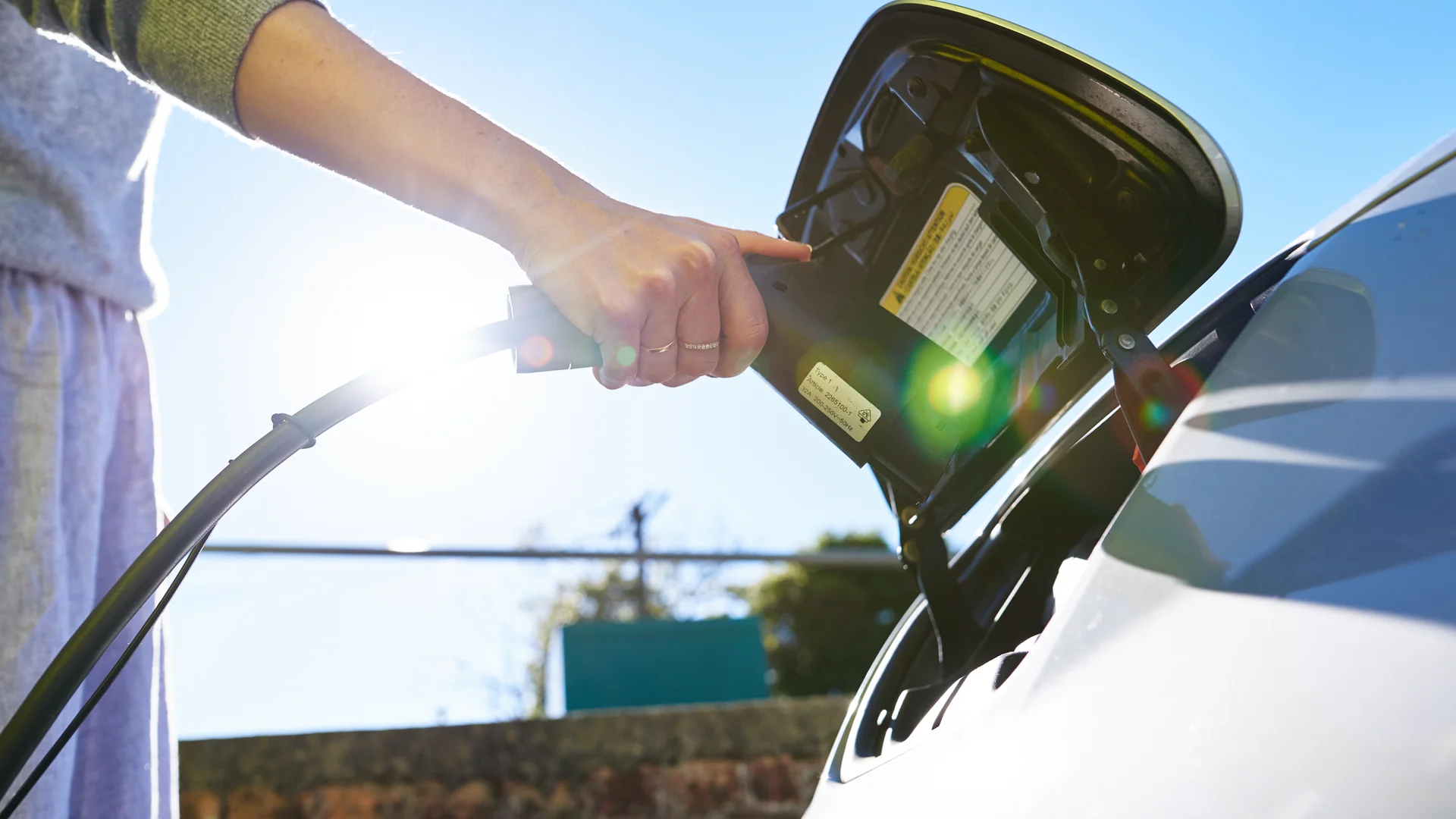 Person with EV charger