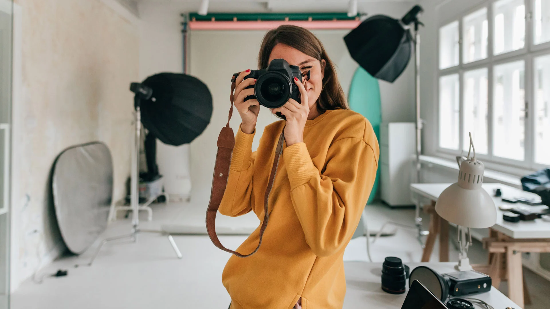 Professional photographer taking photos in her studio.