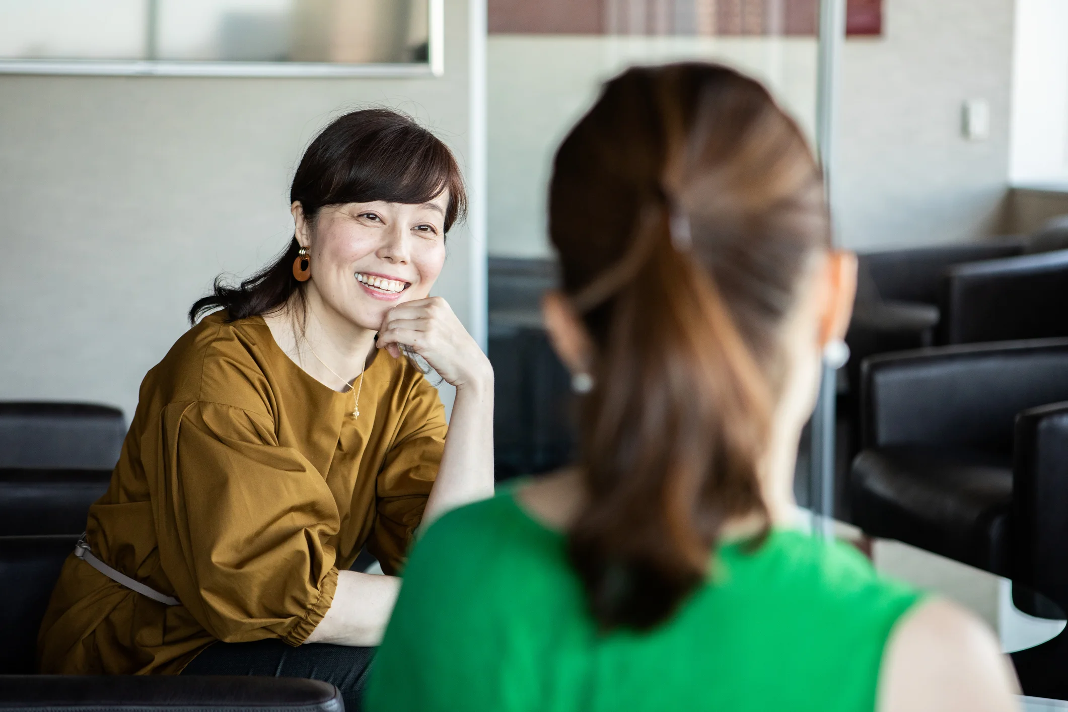 A woman talking to a colleague