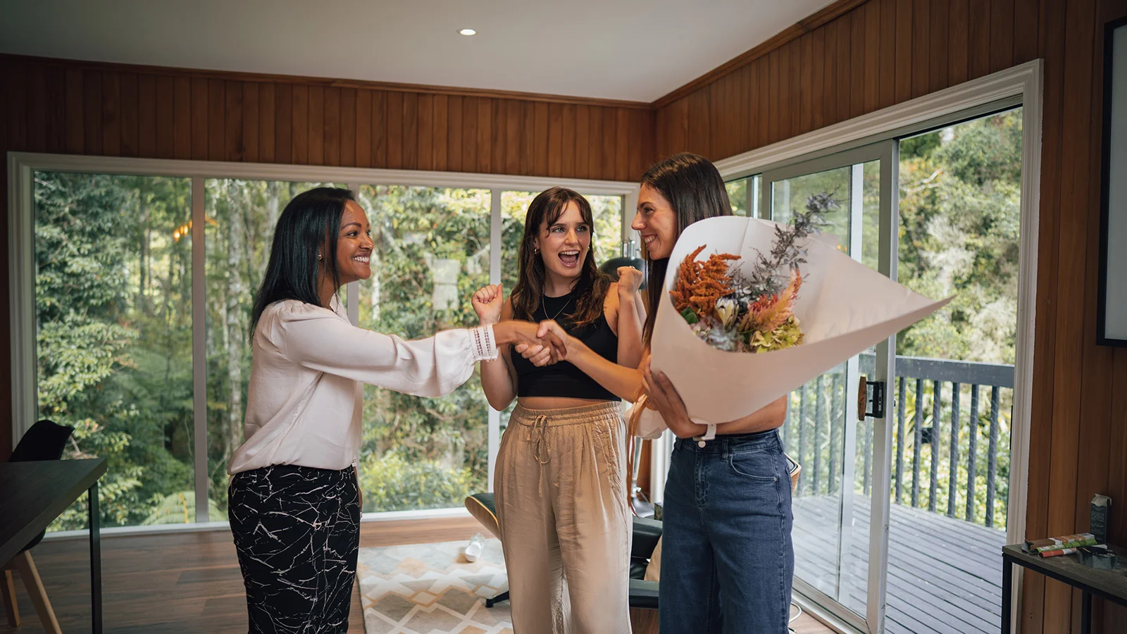 People celebrate selling a house