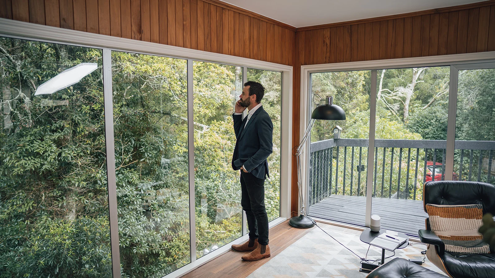 Man on phone talking about an investment property home loan. 