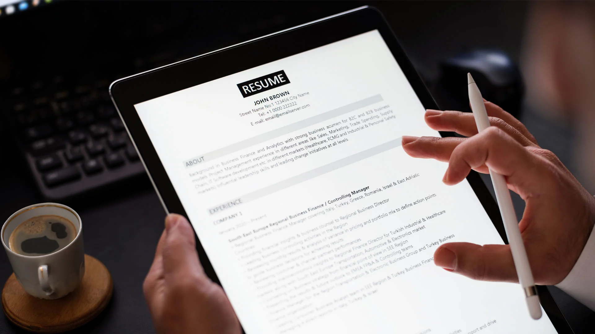 Employer reading a CV they have received from a job applicant.