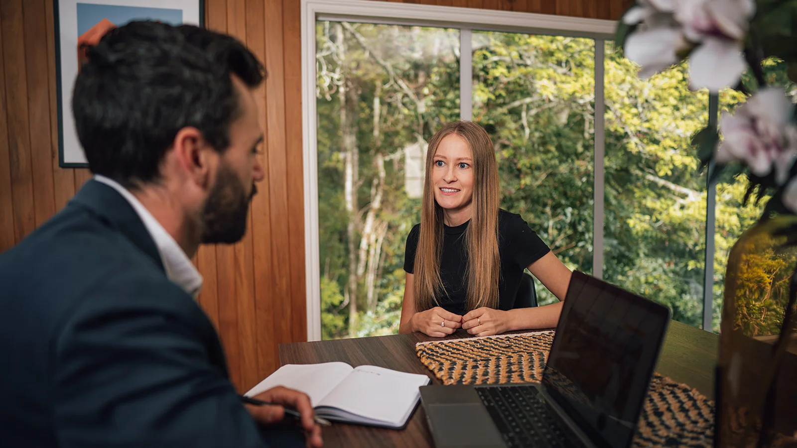 Woman talking to mortgage broker about getting home loan pre approval