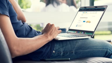 writing listing on laptop