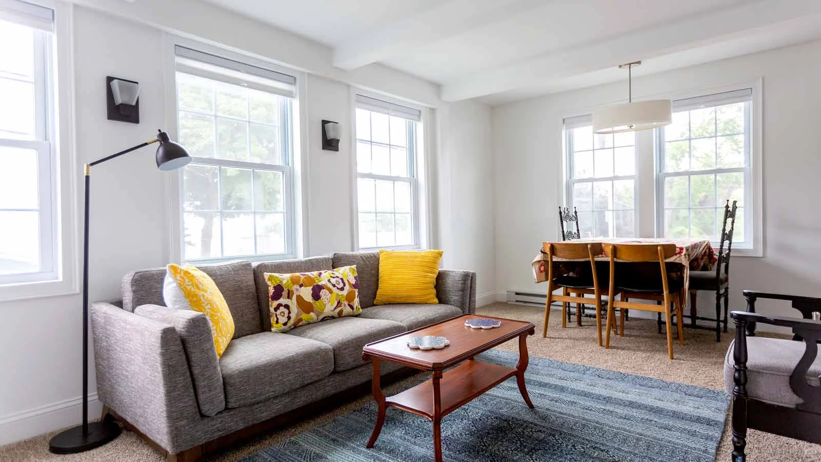 Laptop and mobile device showing Trade Me Property web features.