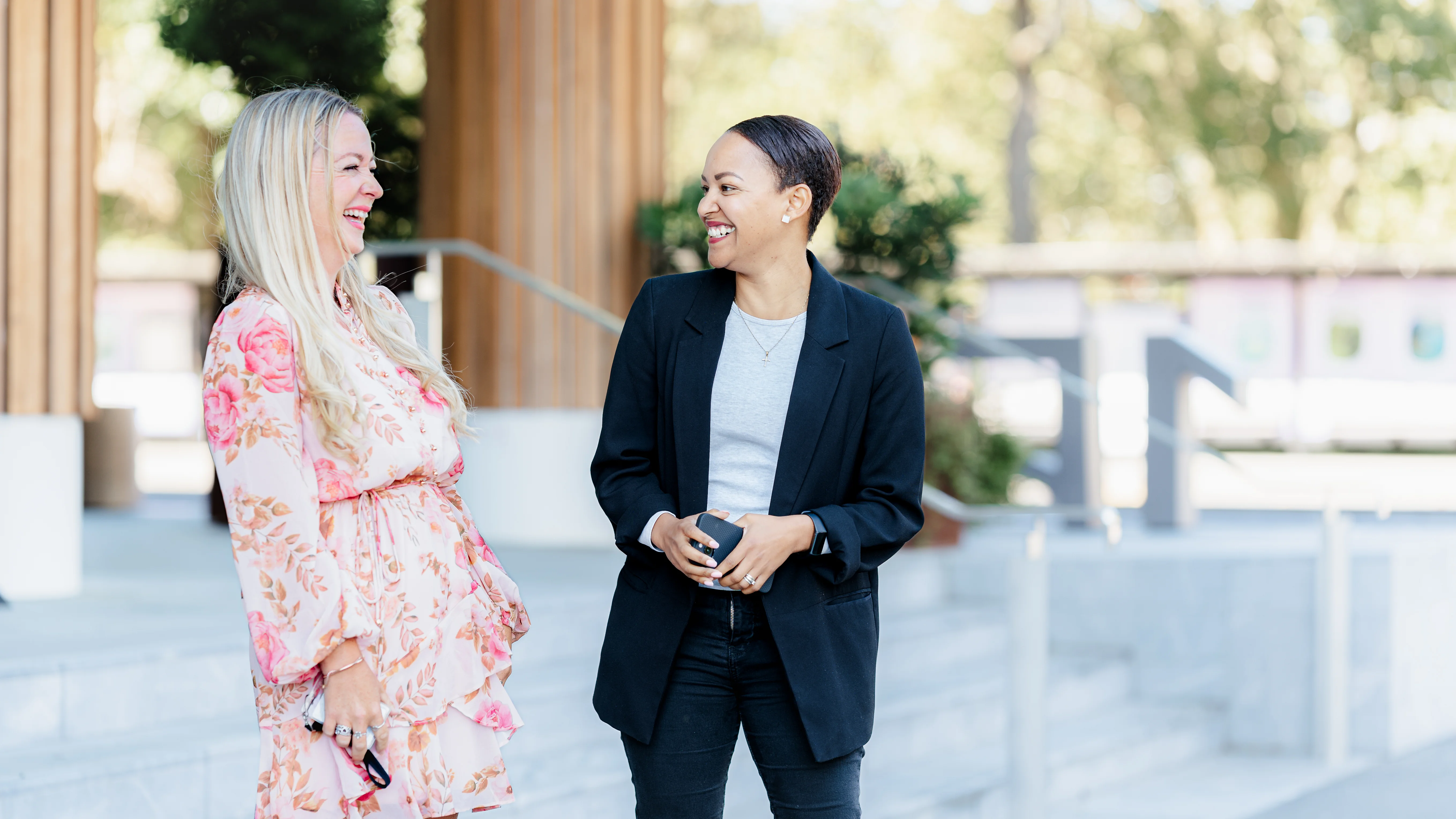 two women chatting outside 