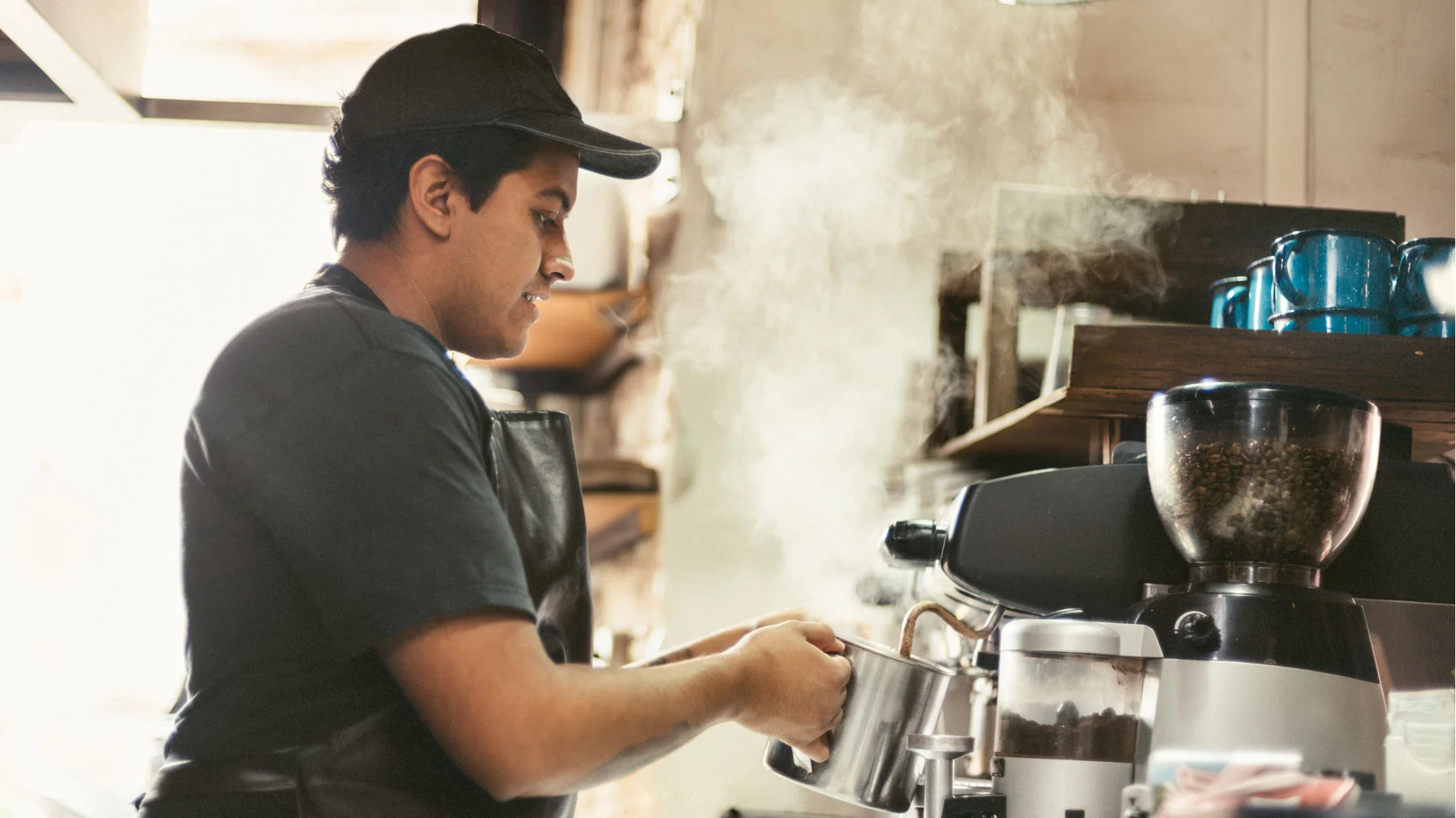 Student barista working in a cafe.