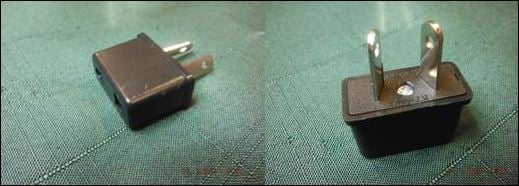 two elevations of an illegal two pin plug, showing no insulation on the pins and holes in the pins.