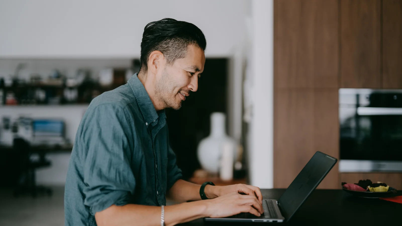 Guy working on laptop. 